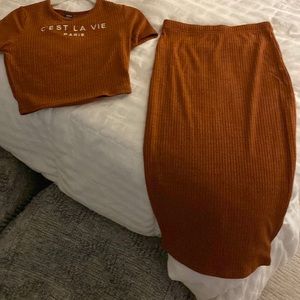 Two piece crop top short sleeve and mid length skirt.